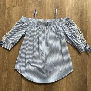 Off the shoulder blue and white striped shirt with cut outs in arms